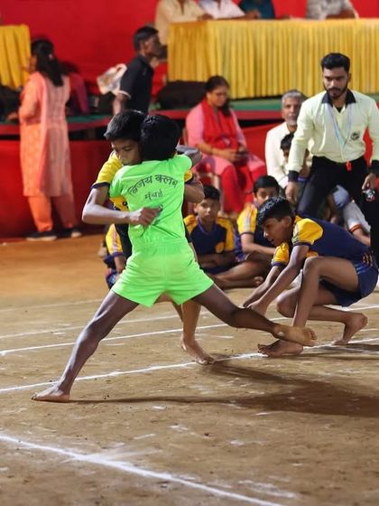An Under-14 player attempting a toe touch during a competitive match.
