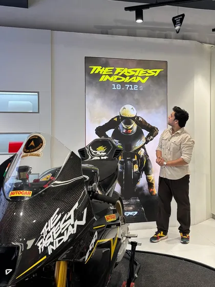 Admiring the record-breaking F99 bike at the Ultraviolette launch event. This shot places me as an aspirational figure alongside a premium product.