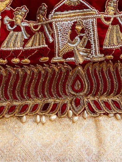 A close-up view of the doli procession motif from one of my favorite bridal blouses. Every stitch is carefully placed to tell a story, making your wedding attire truly personal and meaningful.
