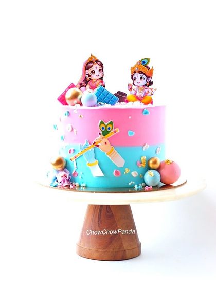 A cute baby shower cake with a Radha Krishna theme. This Chocolate Truffle cake uses a pink and blue design, perfect for a gender reveal or a traditional celebration.