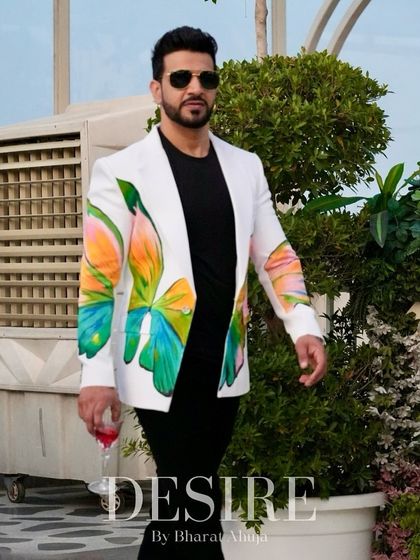 Walking with purpose in the butterfly-print blazer. This look is all about confidence, flair, and making a stylish statement.