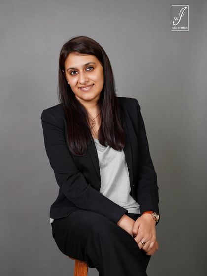 A seated portrait that feels both professional and relaxed, suitable for a company website or personal branding.