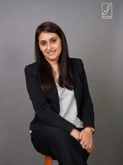 A seated portrait that feels both professional and relaxed, suitable for a company website or personal branding.