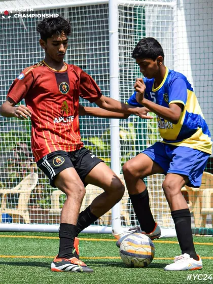 Fast feet, sharp mind. Two players locked in a battle for possession, showcasing their skills.