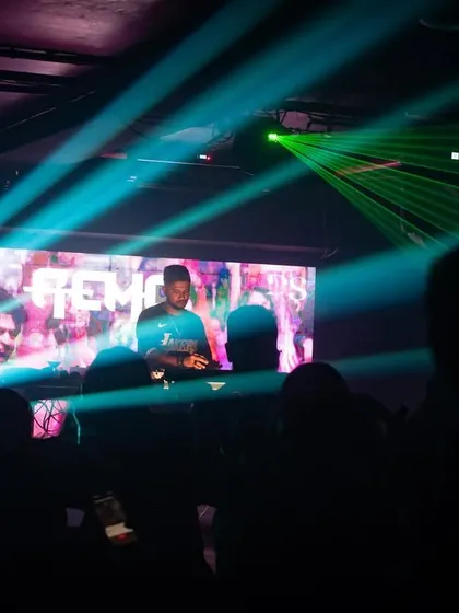 Green lasers slice through the haze at Cyclone Club. This shot showcases the club's impressive lighting system.