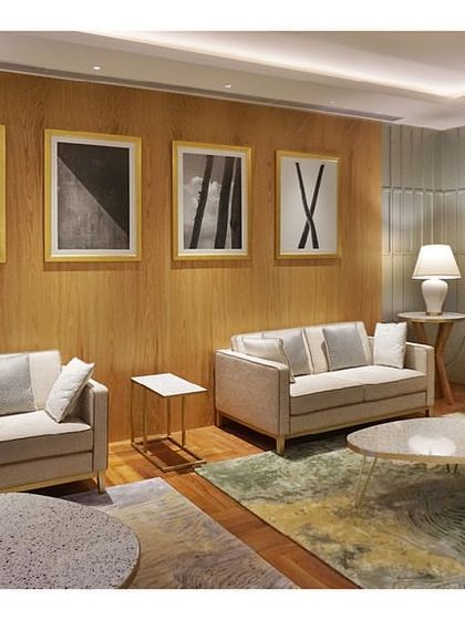 A full view of the Private Lounge at the Bangalore airport, showing the arrangement of multiple seating groups. The space is designed to feel like a high-end living room, offering comfort and privacy for VVIP guests.