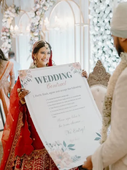 A fun and modern twist on tradition. The bride presents a "Wedding Contract" to the groom, a playful moment filled with laughter that I love to capture.