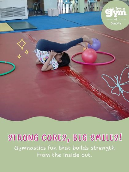 Strong cores, big smiles. This student practices a plow pose, a gymnastics drill that builds core strength and spinal flexibility, essential for more advanced moves.
