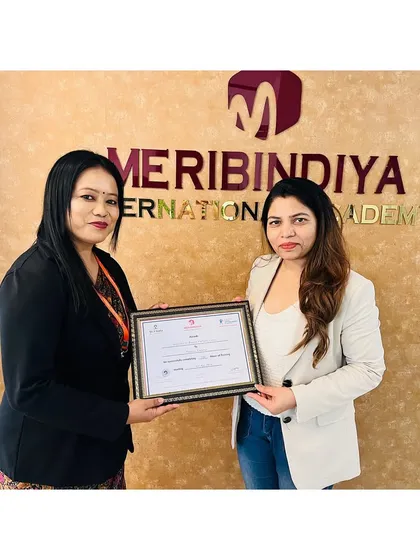 We celebrate every student's success. Here is another graduate receiving her certificate, marking the start of a new chapter.