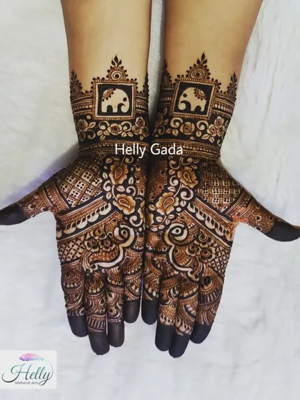 Another look at the simple designer mehndi with elephant motifs. The contrast between the dark, filled-in areas and the delicate line work is what makes this style so effective.