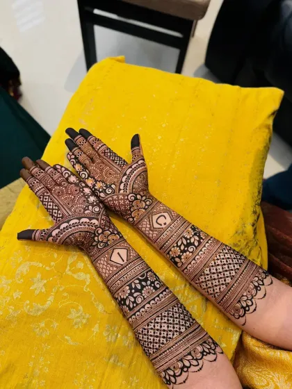 A different angle of the initialed bridal mehndi, showing how it looks in a natural setting. The design is clear, sharp, and made to last through your wedding celebrations.