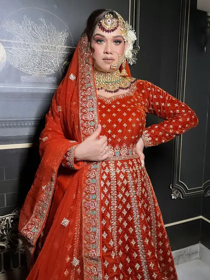 An extensive series from a bridal demo, showcasing a red velvet Anarkali-style lehenga. This is a valuable resource for MUAs learning to create a classic bridal look.