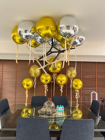 We filled this modern dining space with chic gold and silver orb balloons for Arjun Kapoor's birthday dinner, creating a festive yet sophisticated look.