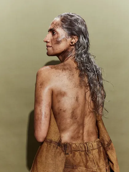 A raw and evocative look from the Huemn show, where the styling and makeup tell a story of survival and strength.
