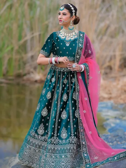 I scout stunning outdoor locations that serve as the perfect backdrop for your photoshoot. This shot combines a gorgeous rental lehenga with a serene waterside setting for a truly breathtaking fashion portrait.