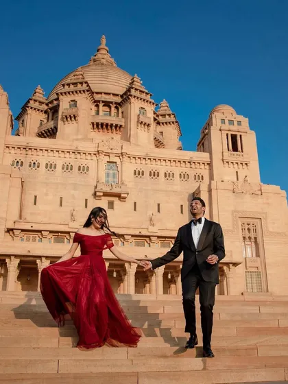 Mahika and Vedansh walk down the steps of the Umaid Bhawan Palace in Jodhpur. The stunning backdrop pales in comparison to their radiant laughter, but it makes for an epic portrait.