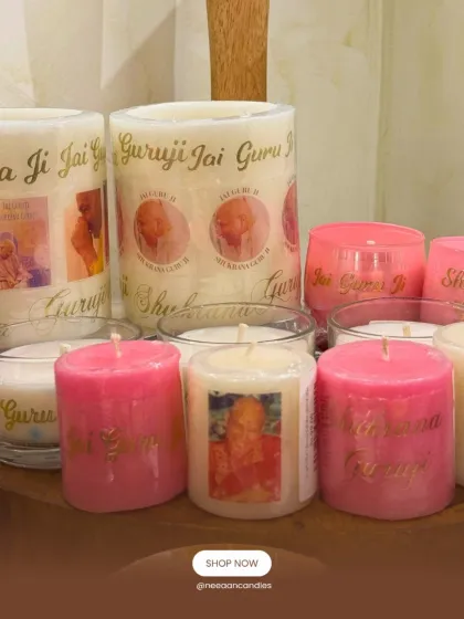 Celebrating Guruji’s Birthday Month. This collection of pillar and jar candles features photos of Guruji and messages like 'Shukrana Guruji', carrying blessings in every flame.