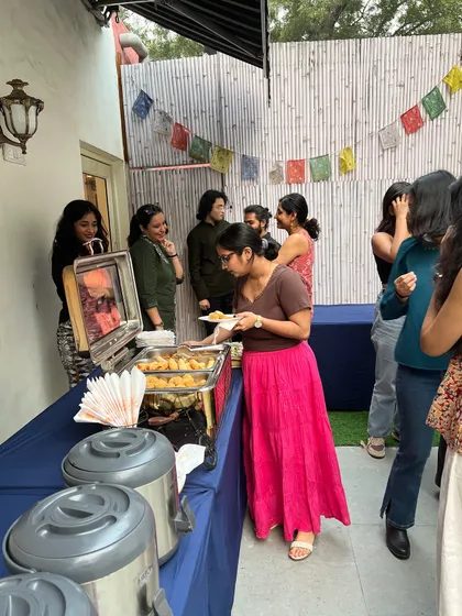 It's not a workshop without good food. Participants enjoy snacks and socialize during a break at our 'Verse & Voice' series, building connections outside the classroom setting.