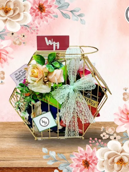 A slightly different view of the hexagonal gold wire basket, showcasing the beautiful floral arrangement and lace ribbon.