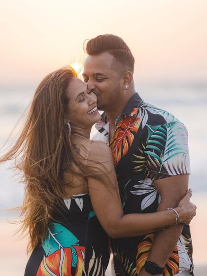 The golden hour light, the sea breeze, and a happy embrace. This is the essence of a beach pre-wedding shoot, full of warmth and genuine affection.