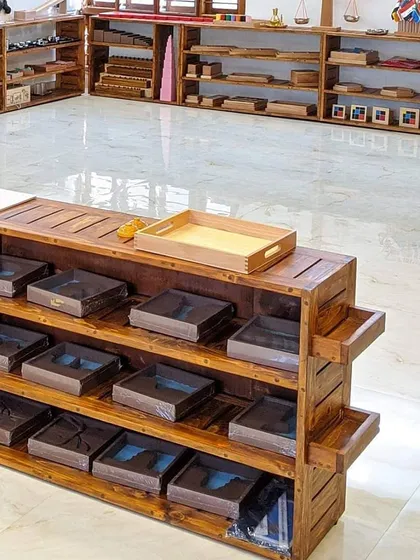 Welcome to our prepared environment. The shelves are filled with Montessori materials, openly accessible for children to choose their own work. This setup is the foundation of self-directed learning, allowing each child to follow their curiosity at their own pace.