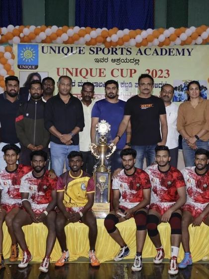 The winning team of the Unique Cup 2023 Kabaddi tournament with their championship trophy.