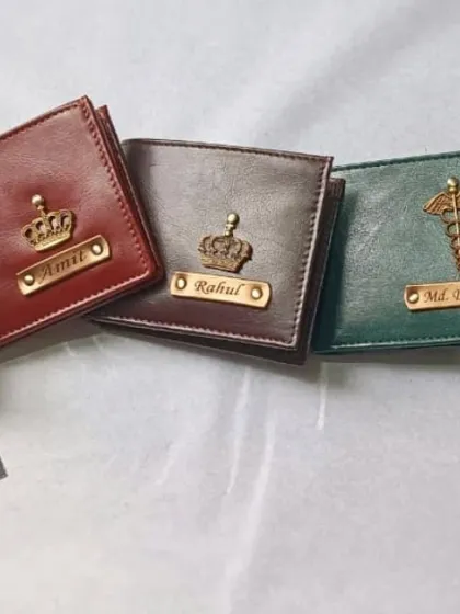 A lineup of my personalized wallets showcasing the different color and charm combinations available, from blue with an infinity charm to green with a doctor's caduceus symbol.