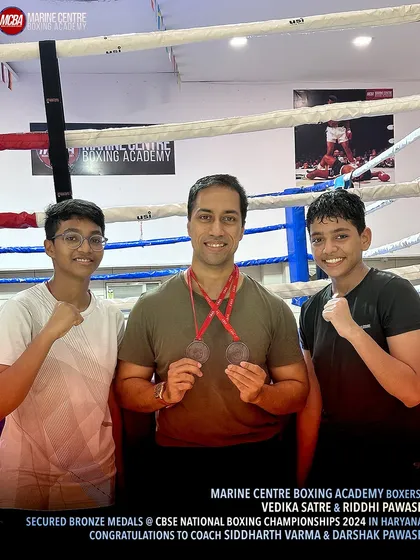 Our founder, Mr. Devraj Das, with our two national bronze medalists, Vedika and Riddhi.