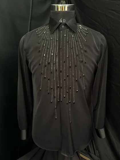 This black designer shirt is adorned with cascading black beads and sequins, creating a look of understated glamour. It's perfectly tailored for a lasting impression.
