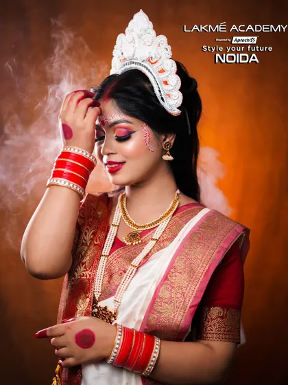 A stunning Bengali bridal look with a traditional mukut and alta on the hands. Our students master these authentic details to become true professional bridal artists.