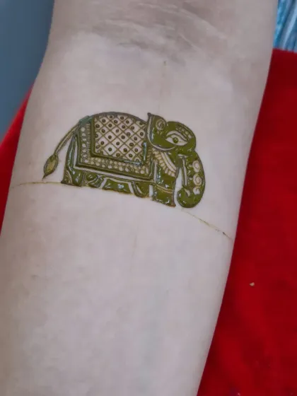 The first step in creating a beautiful elephant motif. The outline is carefully drawn before the intricate filling patterns are added.