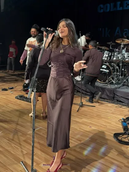 A full-length view of me performing during the final show at the Abhivyakti festival, with the drum kit and band in the background.
