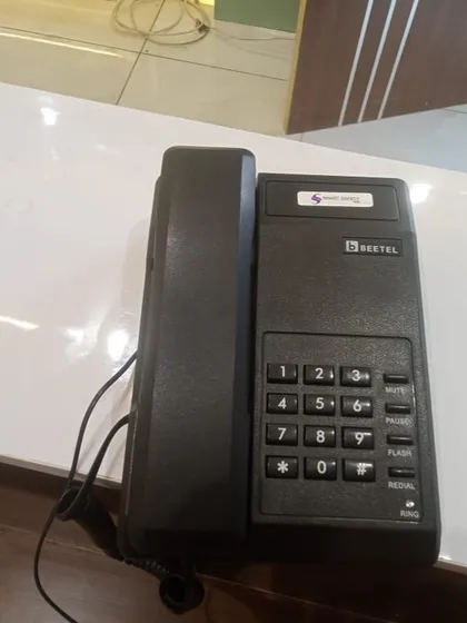 A Beetel phone placed on a clean, white office counter, part of a recent multi-extension installation.
