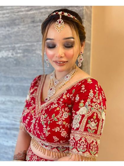 A close-up of a glamorous party look. The smokey eye and defined brows create a bold and confident style.