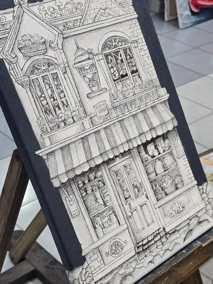 Precision and patience are key in our micron pen classes. This detailed architectural drawing on canvas showcases the intricate line work and perspective skills our students develop.