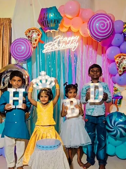 Our decorations are made for making memories. This colorful Candyland-themed birthday party is full of fun details, from the vibrant balloon arch and neon sign to the personalized marquee letters that the kids love to hold.