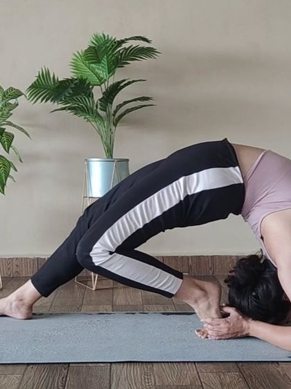 This is a deep backbend variation from a forearm stand. It combines the challenge of an inversion with a significant spinal opening, requiring both strength and flexibility.