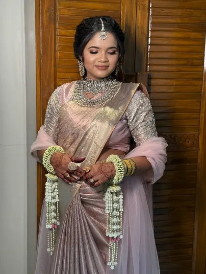 A close-up of the bride, showing her soft makeup and elegant jewellery.