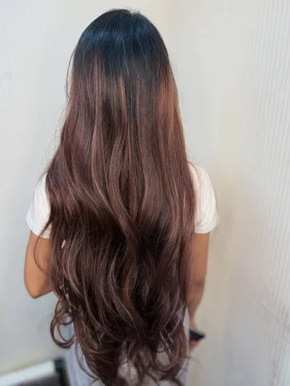 The back view of this long balayage shows how the color is concentrated towards the ends for a natural, grown out look.