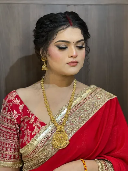 A serene shot with eyes closed, showcasing the detailed eye makeup and the classic simplicity of the look.