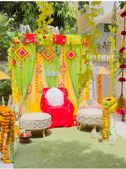 Here is a vibrant outdoor Mehendi setup I did in a client's garden. I used colorful drapes, traditional Rajasthani umbrellas, and lots of marigold garlands to bring a festive, folk vibe to the celebration.