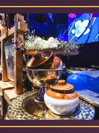 Our setups often include traditional Indian elements like these ceramic pickle jars (martabans), adding an authentic touch to the culinary experience.