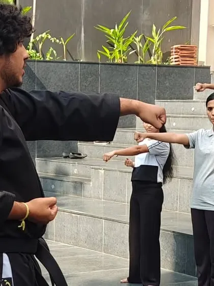 During a workshop for the students at ISBR Business School, my instructors guide participants through fundamental striking techniques. Every session involves active practice to ensure each person understands the movements correctly.