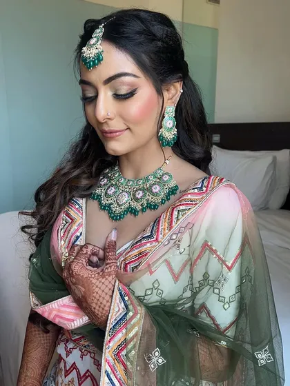 To the most gorgeous and fun-loving bride ever. For her Mehendi, we started with a subtle and soft look. Her skin glowed like diamonds under the sun.