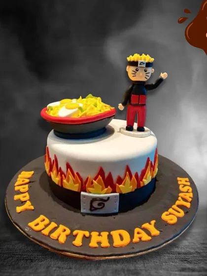 This cake is perfect for a Naruto fan, featuring a fondant figure of the character next to his favorite bowl of ramen. The base of the cake is decorated with edible flames and the Hidden Leaf Village symbol.