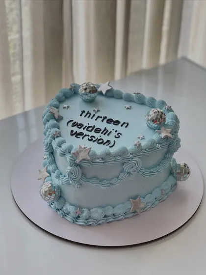 A closer look at the Taylor Swift inspired heart-shaped cake, perfect for a 13th birthday celebration.