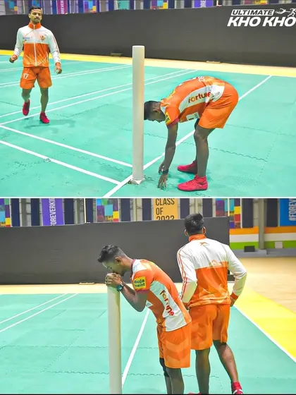 A moment of reverence. Deepak Madhav pays respect to the pole before starting his game, a tradition that connects the professional stage back to the roots of the sport.
