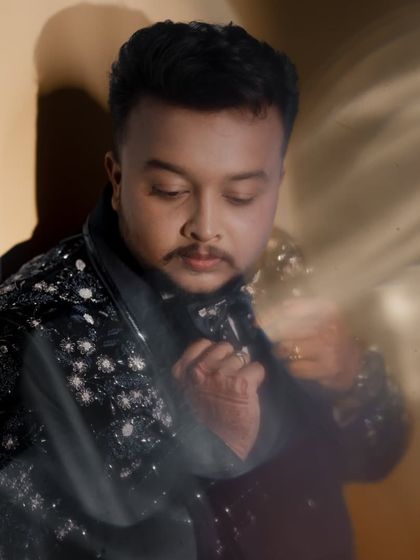 A creative portrait of the groom with a soft, dreamy light effect.