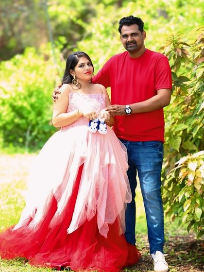 This unique asymmetric gown features layers of peach and red net, creating a beautiful ombre effect. It's a playful and colorful option for an outdoor shoot.