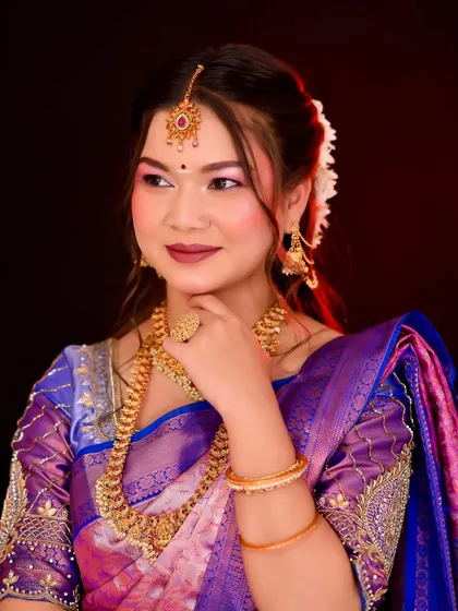 A portrait of the South Indian bride, emphasizing the stunning makeup and traditional look.